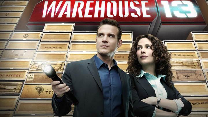 Warehouse 13 – Eddie Mcclintock Torch In Hand And Joanne Kelly